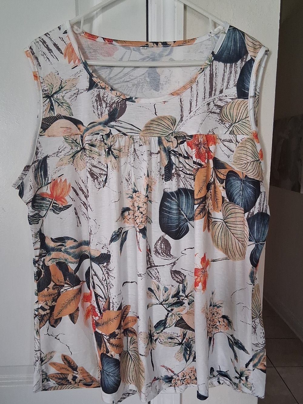 B: Sleeveless Floral Print Women’s Top - White with Blue & Tan Leaves